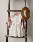 White Cross Back Linen Pinafore with Wings