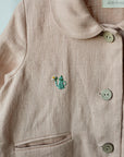 a close up of a shirt with buttons on it