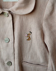 a close up of a shirt with buttons on it